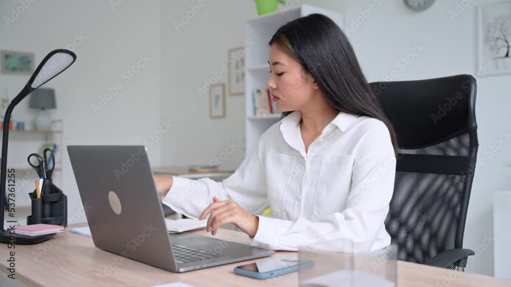 Young asian woman working on laptop holding online conference business meeting Young asian woman working on laptop holding online conference business meeting