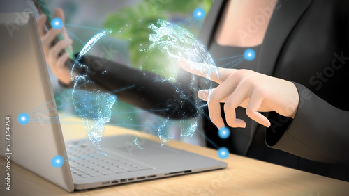 Photos Businesswoman touching a virtual earth