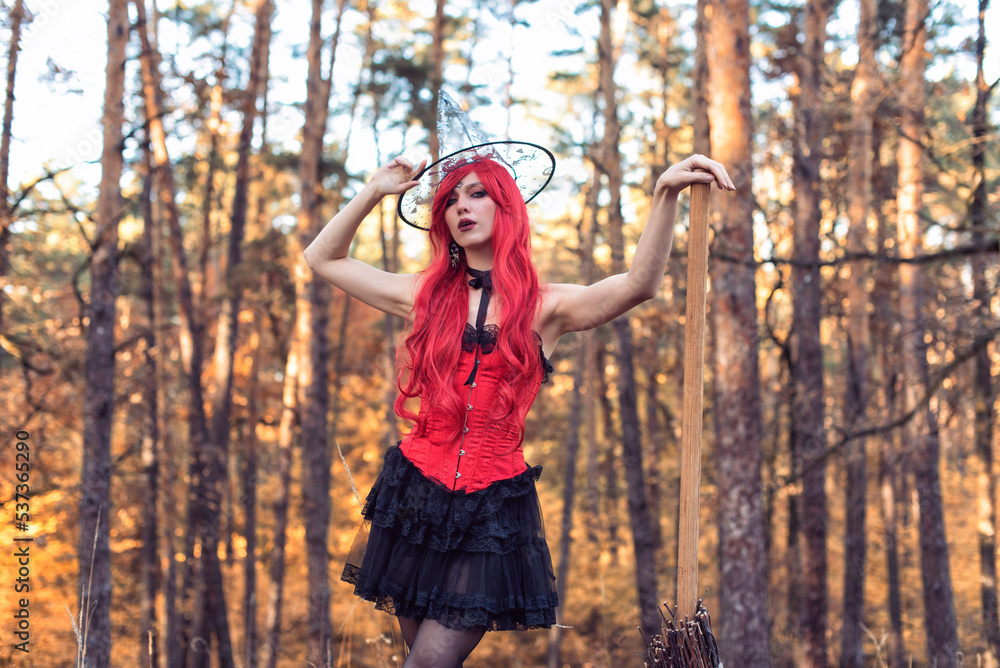 Young witch in autumn forest Young witch in autumn forest
