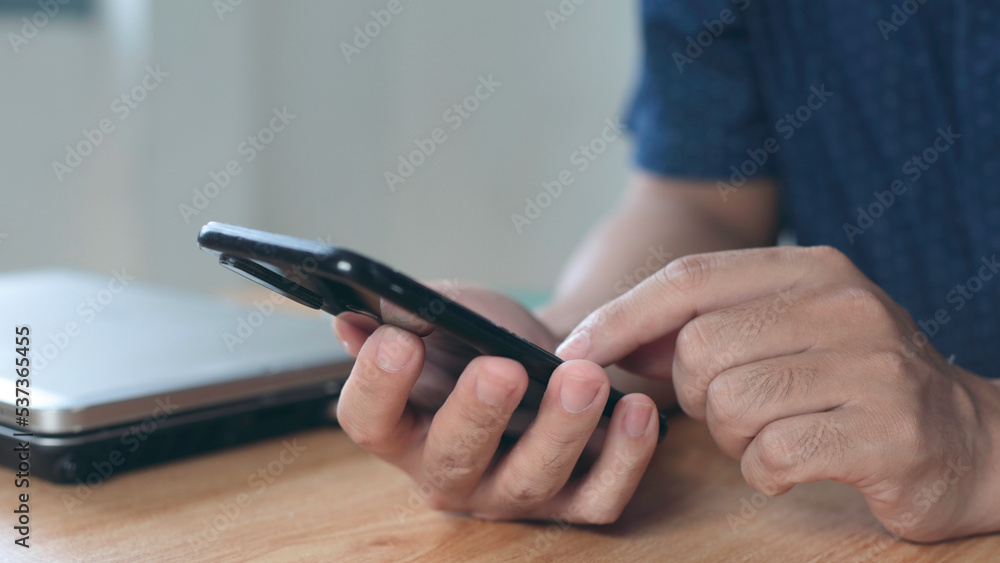 Close up of a man using mobile smart phone Close up of a man using mobile smart phone