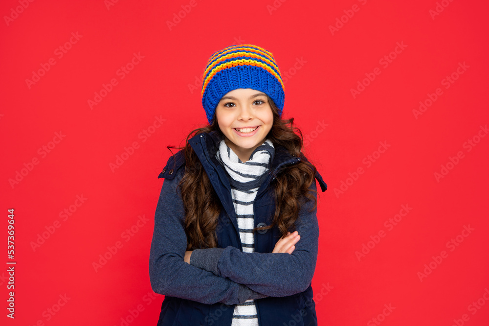express positive emotion. winter fashion. happy kid with curly hair in hat. teen girl express positive emotion. winter fashion. happy kid with curly hair in hat. teen girl