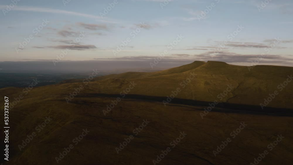 Aerial drone view of the summit of Pen-y-Fan mountain in the Brecon Beacons national park, Wales. beautiful welsh landscape in the brecon beacons. Aerial clip of rolling countryside of the Usk Valley. Aerial drone view of the summit of Pen-y-Fan mountain in the Brecon Beacons national park, Wales. beautiful welsh landscape in the brecon beacons. Aerial clip of rolling countryside of the Usk Valley.
