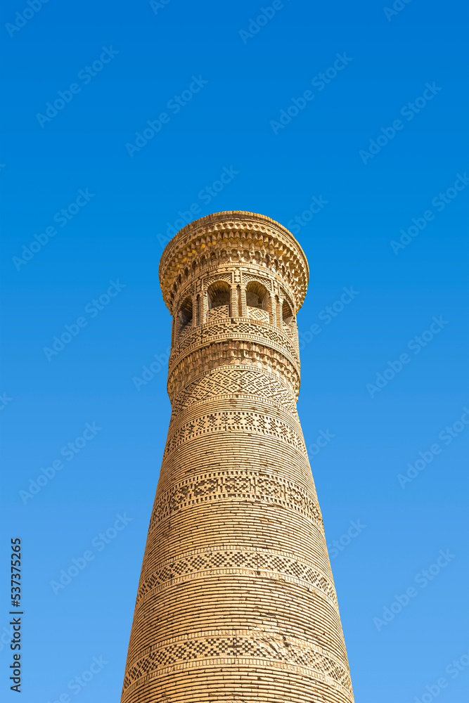 Khoja-Gaukushan Minaret in Bukhara against the blue sky