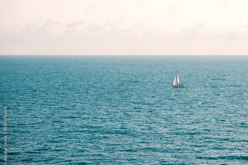 Lonely sailboat sailing in the Black Sea