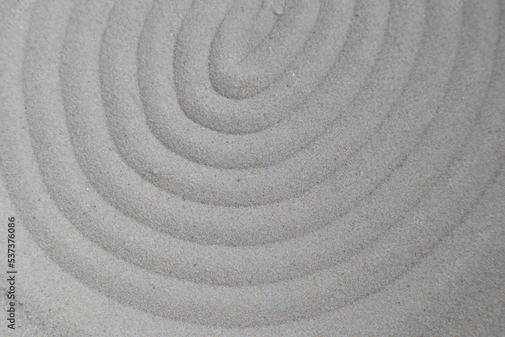 The background is made of fine clean sand with space for text. Banner, advertisement, poster. The background is made of fine clean sand with space for text. Banner, advertisement, poster.
