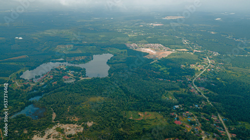 Aerial drone view of rural scenery with a lake at Jasin, Melaka, Malaysia