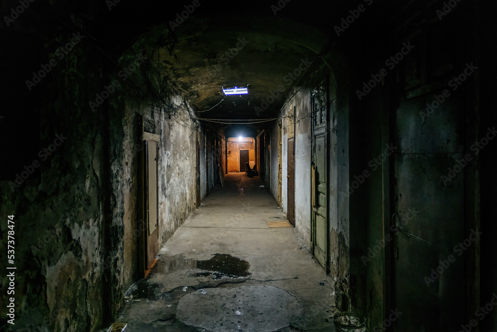 Dark corridor of old shabby dorm or appartment house