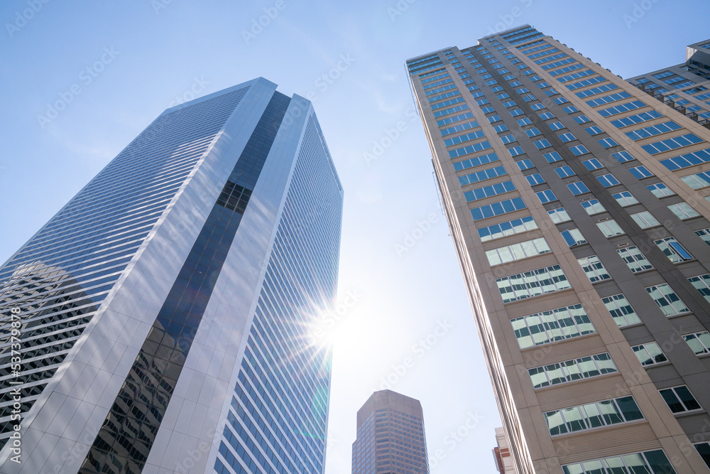 Low angle view of tall skyscraper building in a downtown city