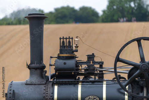 Fototapeta Close up of a steam powered ploughing engine in a field