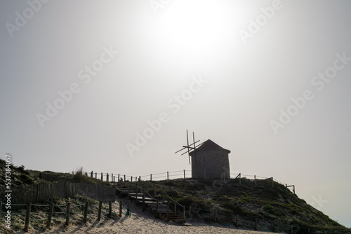 Windmills on the Beach sand dunes. Beach and summer days. Chemin de Saint Jaques, camino Santiago in north Portugal, coastline.  © Vtor
