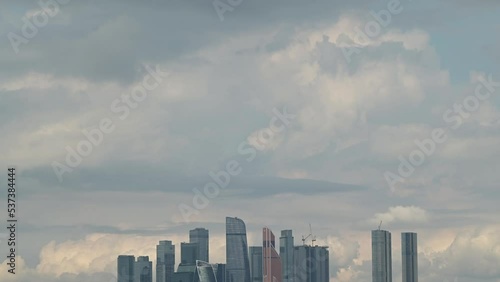 Clouds floating in the sky and the tops of skyscrapers of the Moscow City complex in the Russian capital. photo