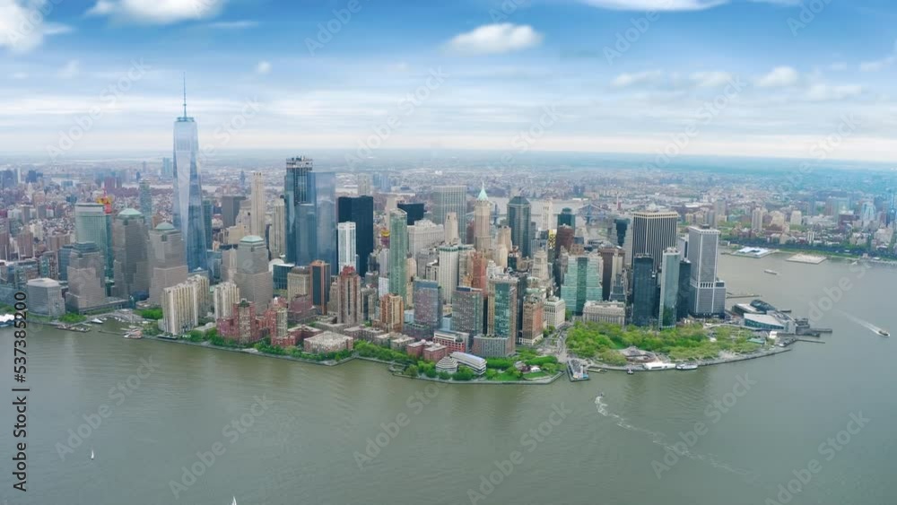 Aerial view of the Financial District. Famous Skyscrapers in Lower Manhattan. Brooklyn Bridge in the background. East and Hudson River. New York City, United States. Shot from a helicopter. Aerial view of the Financial District. Famous Skyscrapers in Lower Manhattan. Brooklyn Bridge in the background. East and Hudson River. New York City, United States. Shot from a helicopter.