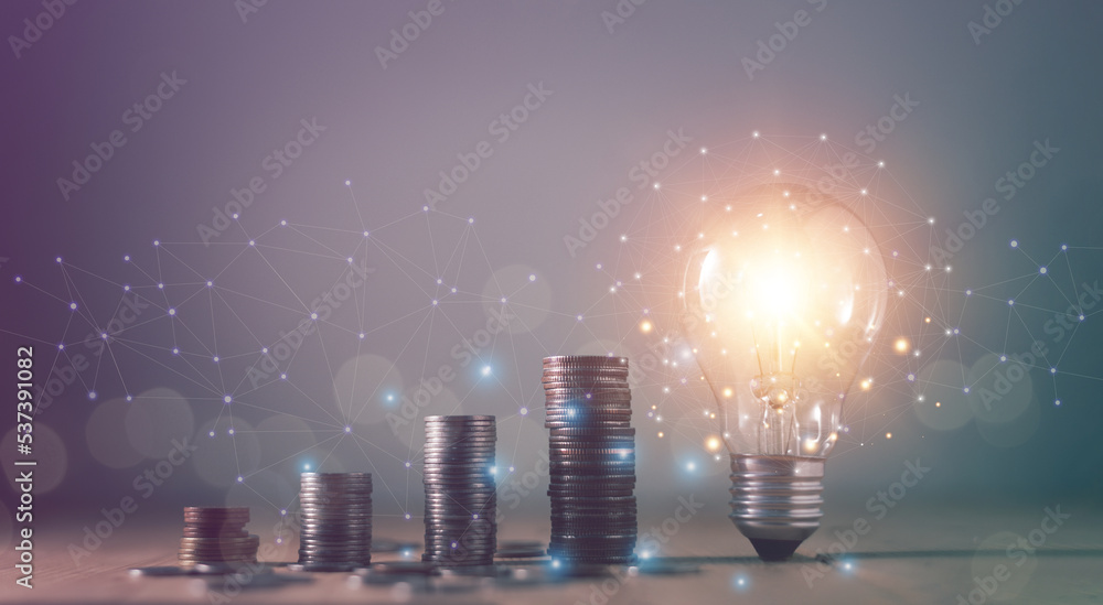 Fototapeta premium Inspiration ideas for financial and business growth concept, Coins stack increasing step by step with bright of light bulb, Business Strategy, Finance and banking, Forecast for success.