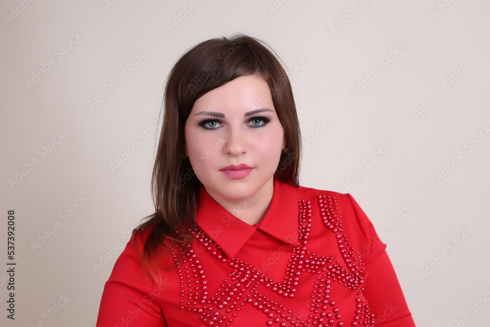 beautiful fashionable young plump fat big oversize girl model on the studio with piercings in a red dress beautiful fashionable young plump fat big oversize girl model on the studio with piercings in a red dress