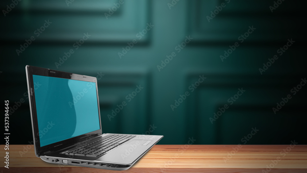 laptop on wooden table laptop on wooden table