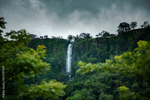 Fresh vegetation at Anton Valley in Panama with a waterfall and cloudscape