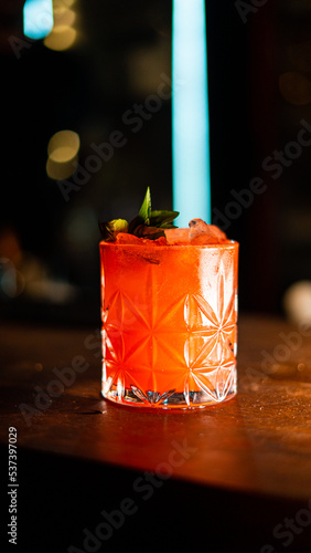 Negroni cocktails with blood oranges panorama on a rustic background