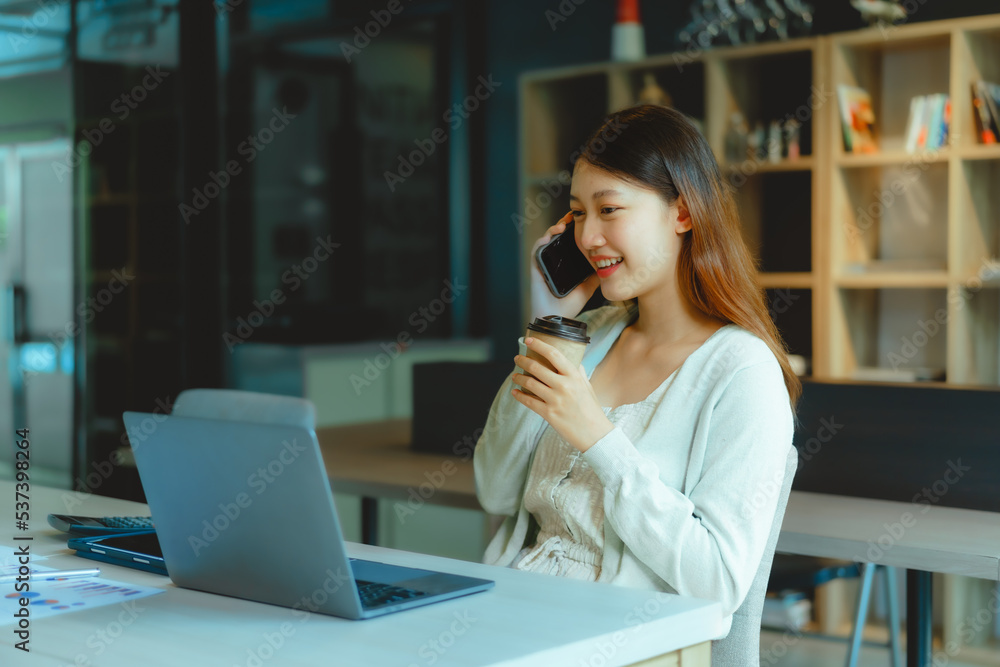Make a phone call, Beautiful young Asian businesswoman working at workspace. Make a phone call, Beautiful young Asian businesswoman working at workspace.