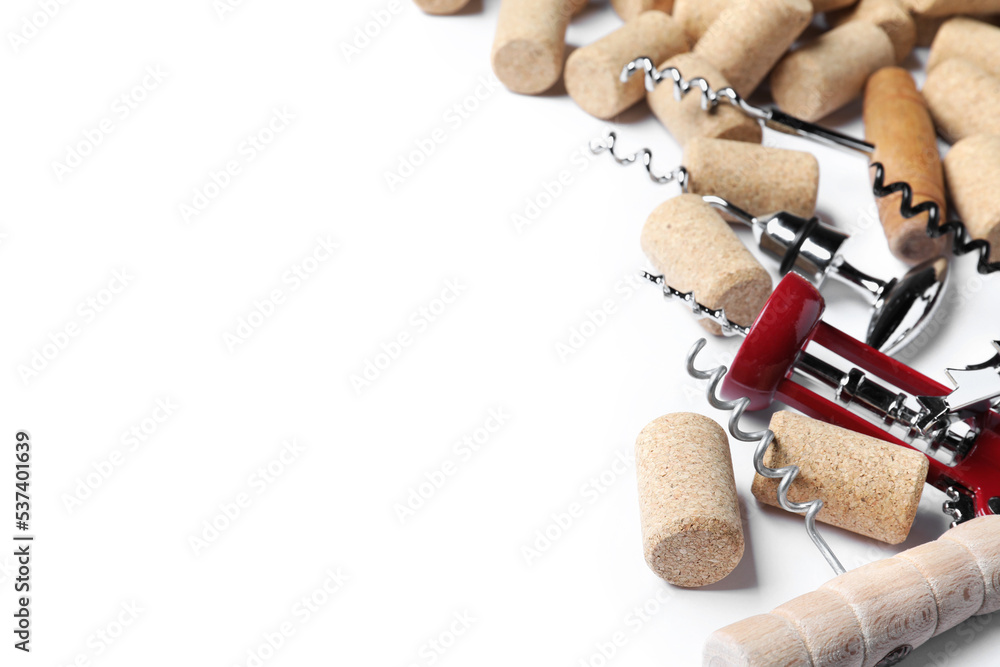Different corkscrews and wine bottle stoppers on white background