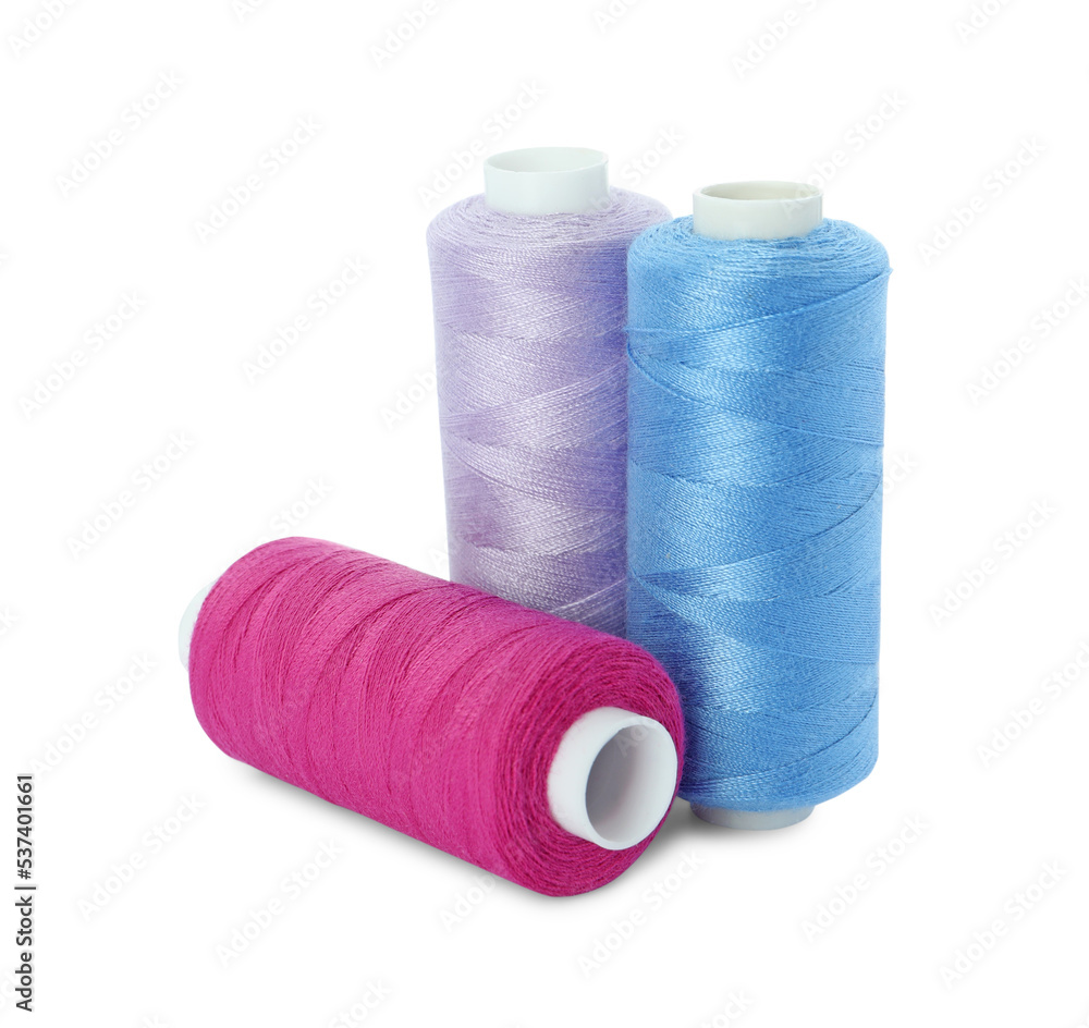 Different colorful sewing threads on white background Different colorful sewing threads on white background
