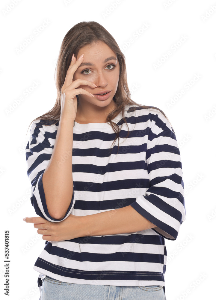 Embarrassed woman covering face with hand on white background Embarrassed woman covering face with hand on white background