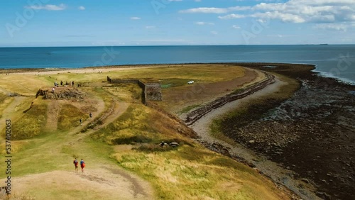 Establishing shot of the Holy Island of Lindisfarne in Northumberland, England, UK,  recorded history from the 6th century AD photo