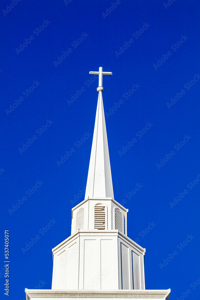 White cross on top of a steeple with copy space White cross on top of a steeple with copy space