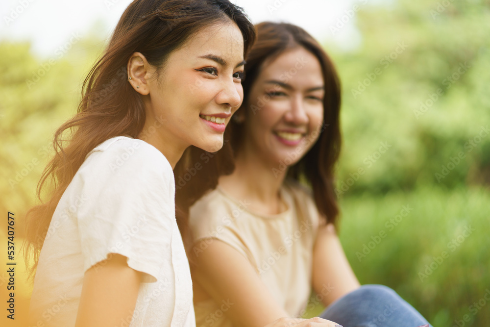 Portrait shot of happy optimistic Asian woman, successful, attractive Asian woman with big smiling and confident, Unaware scene of happy emotion of young healthy woman in natural lifestyle in the park Portrait shot of happy optimistic Asian woman, successful, attractive Asian woman with big smiling and confident, Unaware scene of happy emotion of young healthy woman in natural lifestyle in the park
