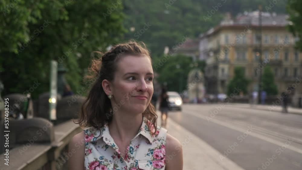 Girl walking Prague street, front closeup view of face or head, cute smile, slow motion, Czech Republic Girl walking Prague street, front closeup view of face or head, cute smile, slow motion, Czech Republic
