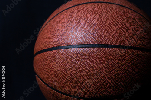 basketball on black background © Don Mroczkowski