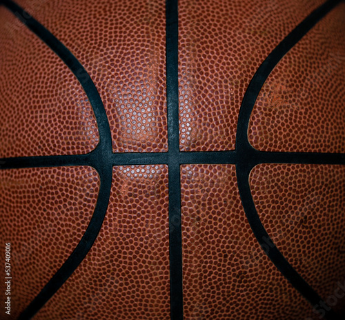 close up of brown leather basketball laces.  © Don Mroczkowski