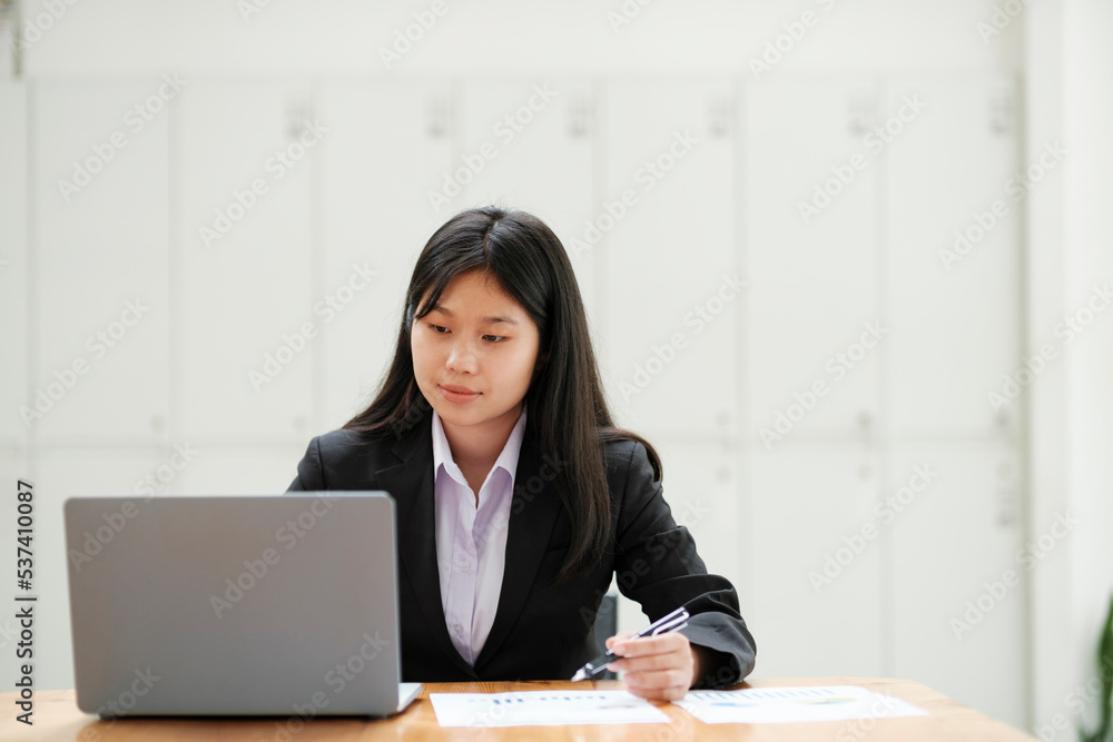 Businesswoman working at office using laptop. Businesswoman working at office using laptop.