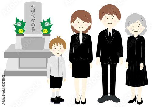お墓参りをする喪服を着た三世帯家族
