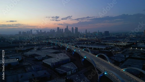 Aerial drone shot of 6th street bridge in Los Angeles, California at night.