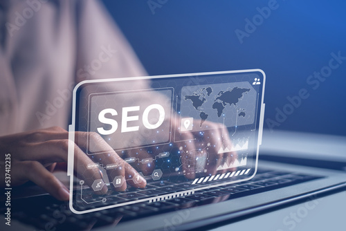Admins using laptops to manage their site improvement tools to provide better search results and boost website traffic rankings. Optimizing website for search engine rankings with SEO tool.