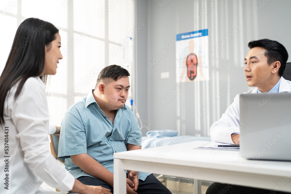 Asian young man and mother visit and consult health problem with doctor. Asian young man and mother visit and consult health problem with doctor.