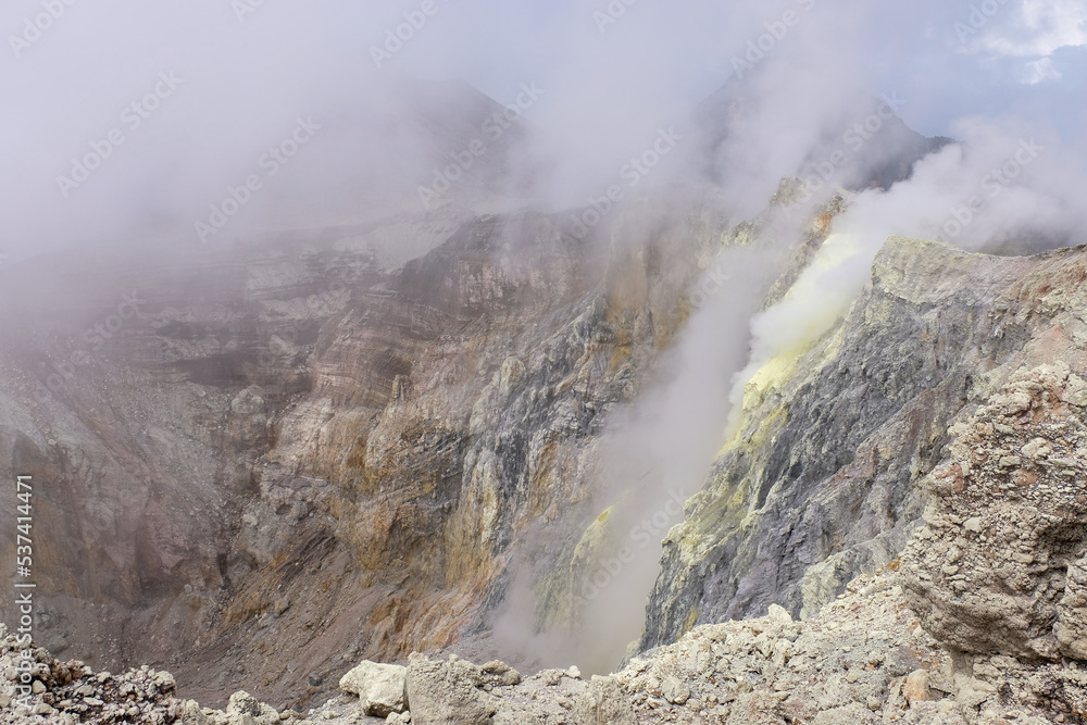 Plumes of sulphuric smoke from the volcanic crater of active volcano, Mount Balbi in remote tropics of Bougainville Island, Papua New Guinea