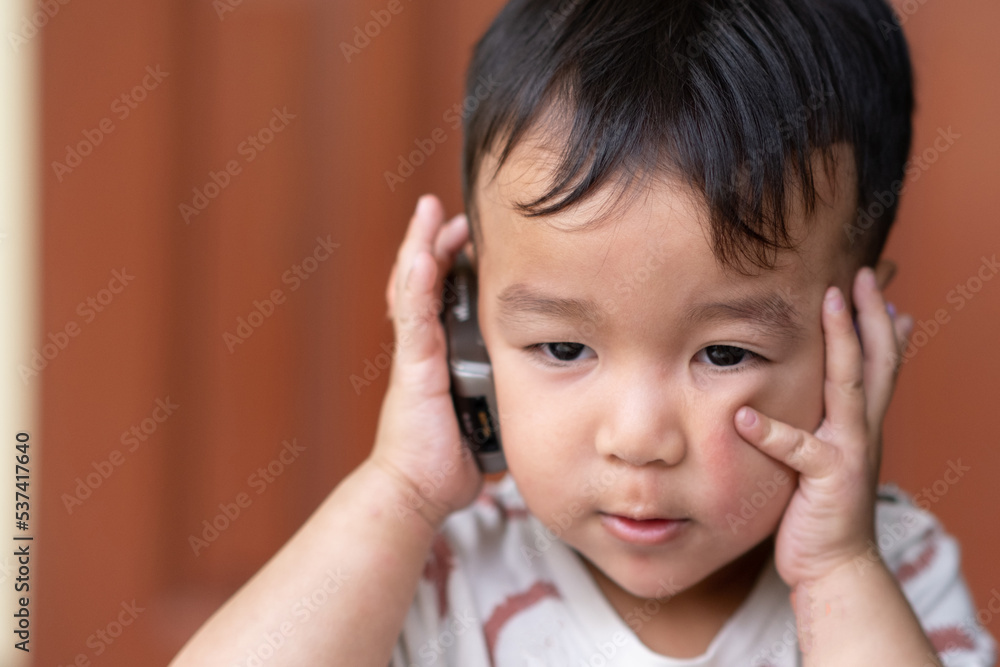 Asian Baby Boy using Mobile Phone Cellphone Asian Baby Boy using Mobile Phone Cellphone