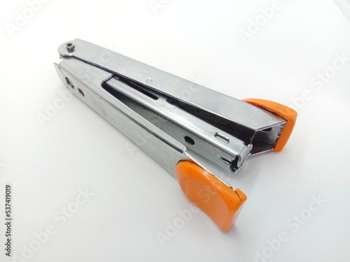 stapler and staples on white