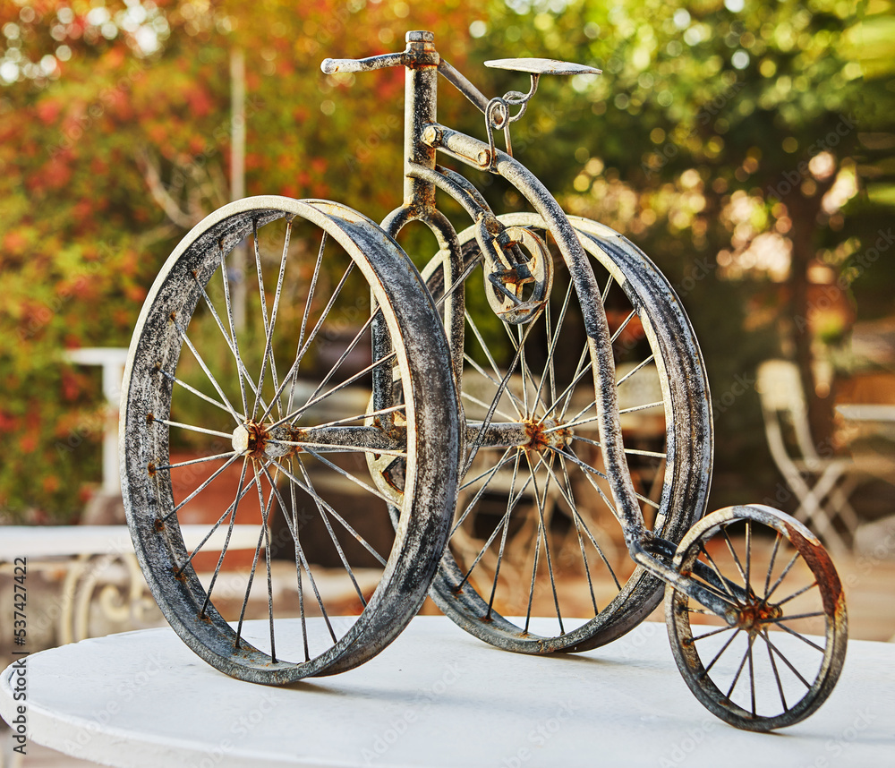 Model of an old tricycle made of metal Model of an old tricycle made of metal