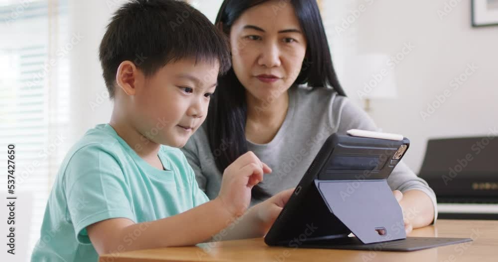 Cute asia people alpha Gen Z kid small boy play video game app online happy mum at home. Enjoy Child care fun class little son and mom study learn upskill idea course on smart digital tablet computer. Cute asia people alpha Gen Z kid small boy play video game app online happy mum at home. Enjoy Child care fun class little son and mom study learn upskill idea course on smart digital tablet computer.