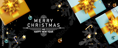 Christmas festive composition with gift boxes, golden bows and tinsel