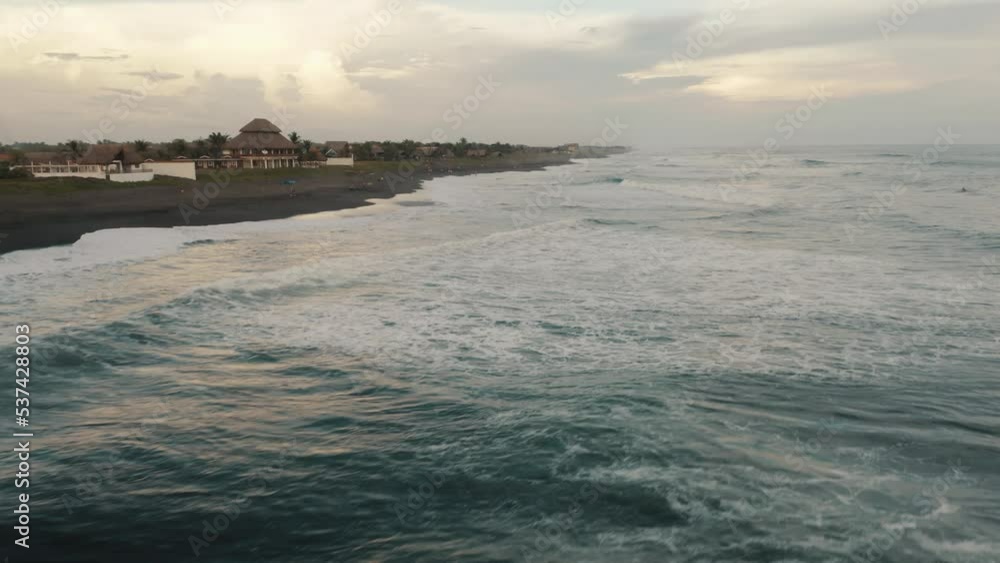 Surfing Waves Hitting The Shore Of El Paredon In Escuintla, Guatemala. Aerial Drone Orbiting Surfing Waves Hitting The Shore Of El Paredon In Escuintla, Guatemala. Aerial Drone Orbiting