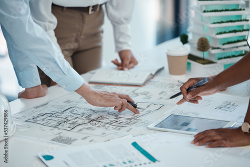 Architect, hands and planning building on paper for construction design or layout at the office. Group hand of employee in teamwork project plan for architecture working on model build or blueprint