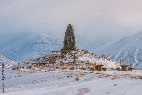 Stephan G Stephansson Monument on the road to Akureyri  with snow mountain on Ring road during winter at Akureyri , North of Iceland : 18 March 2020 photo