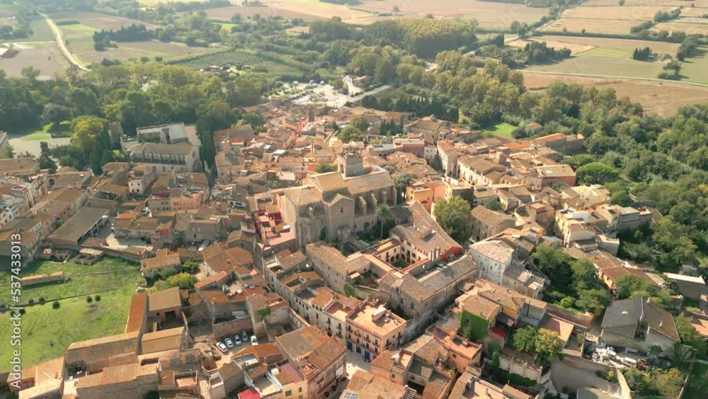 Aerial image of the city of Peralada in Girona Costa Brava small medieval town Circular flight with the Cathedral Church in the center Aerial image of the city of Peralada in Girona Costa Brava small medieval town Circular flight with the Cathedral Church in the center
