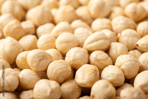 Close up shot of hazelnuts. Peeled nuts background, white nuts