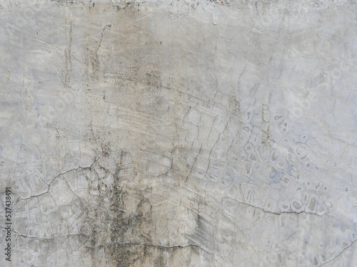 Old gray cement background, cracked, antique and dirty texture.