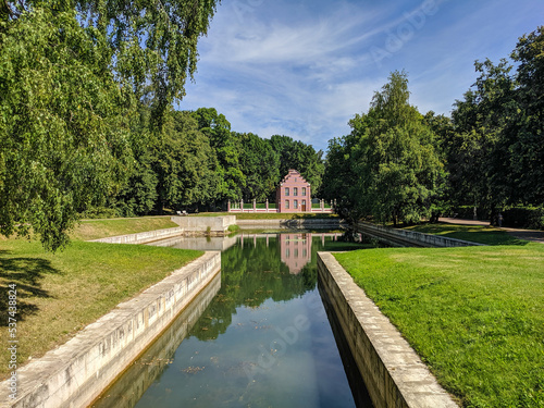 Фотография Moscow, Russia - August 13, 2022: View of the pond and the Dutch house in the Ku