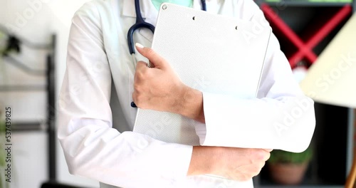 Stethoscope chest of female doctor in medical office photo